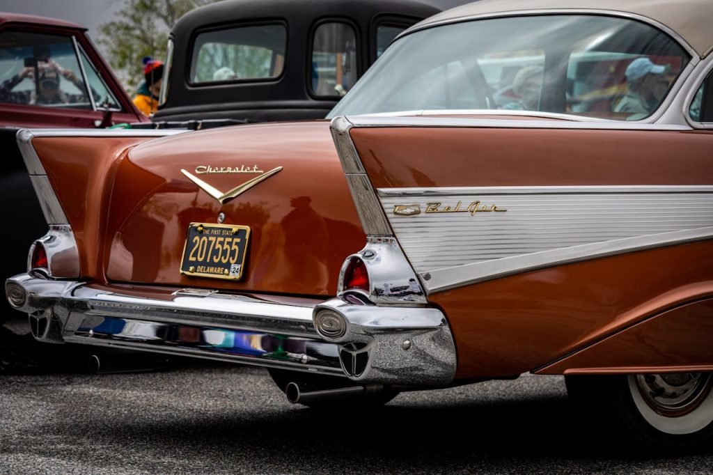 A classic car is parked in a parking lot